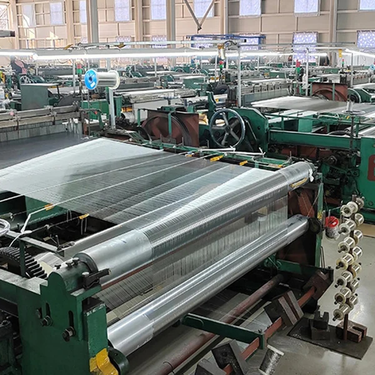 Wire mesh weaving looms inside the WireCloth factory in Anping, China